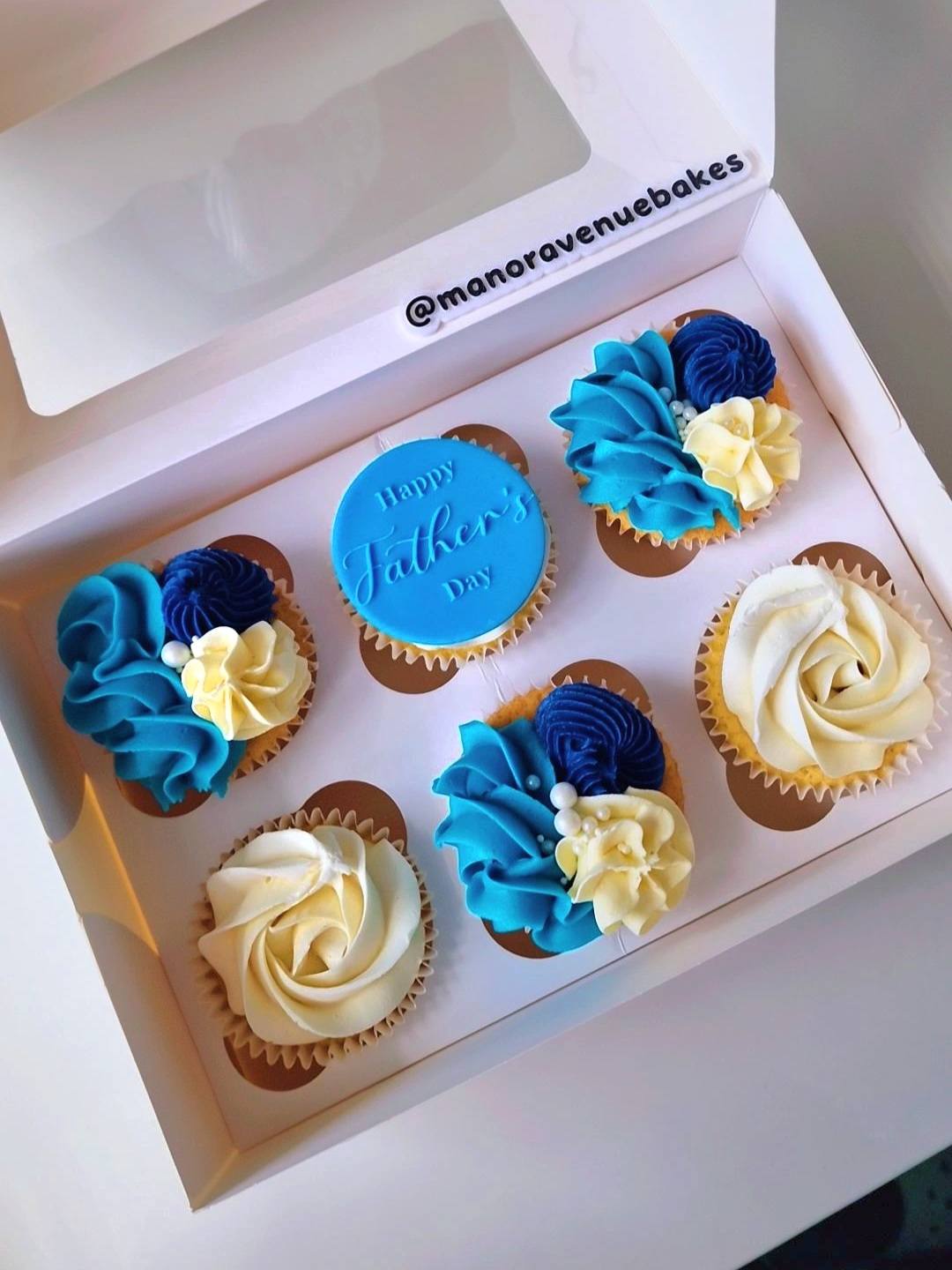 Box of six blue Father's Day cupcakes